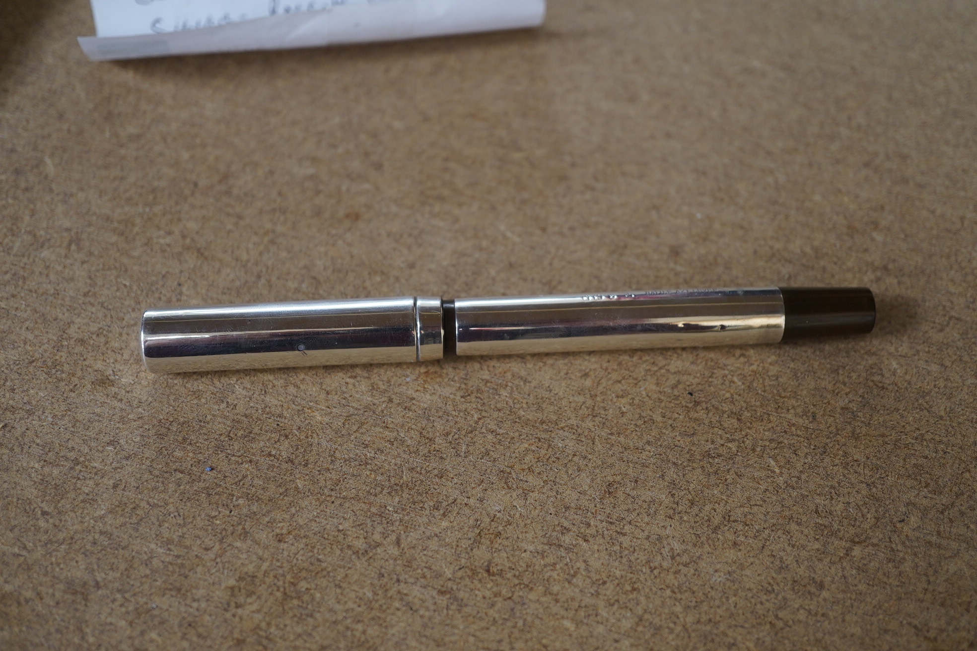 A Battle Axe lever fountain pen in silver, with 14ct gold nib, 14cm in length. Condition - fair